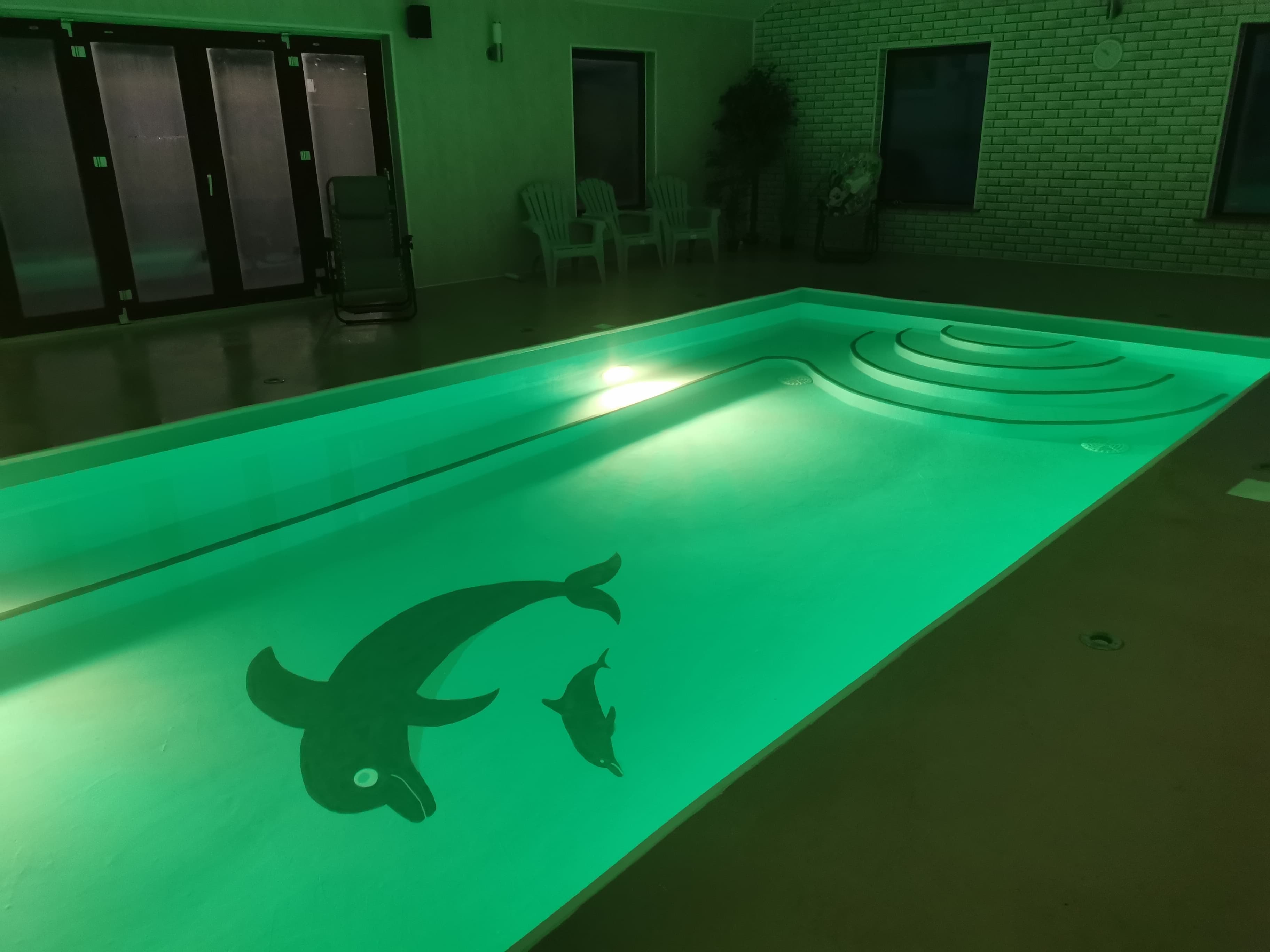 Pool with green mood lighting